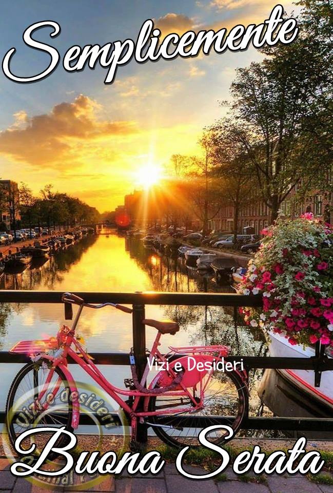 Canale al tramonto, bicicletta rosa, fiori. Semplicemente Buona Serata